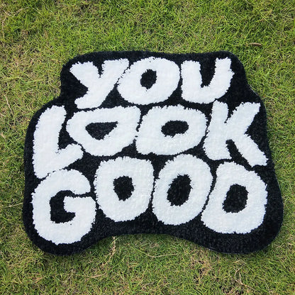 Tufted "You Look Good" Rugs.