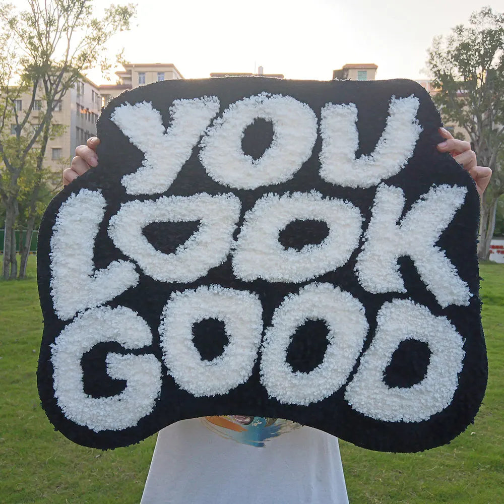 Tufted "You Look Good" Rugs.